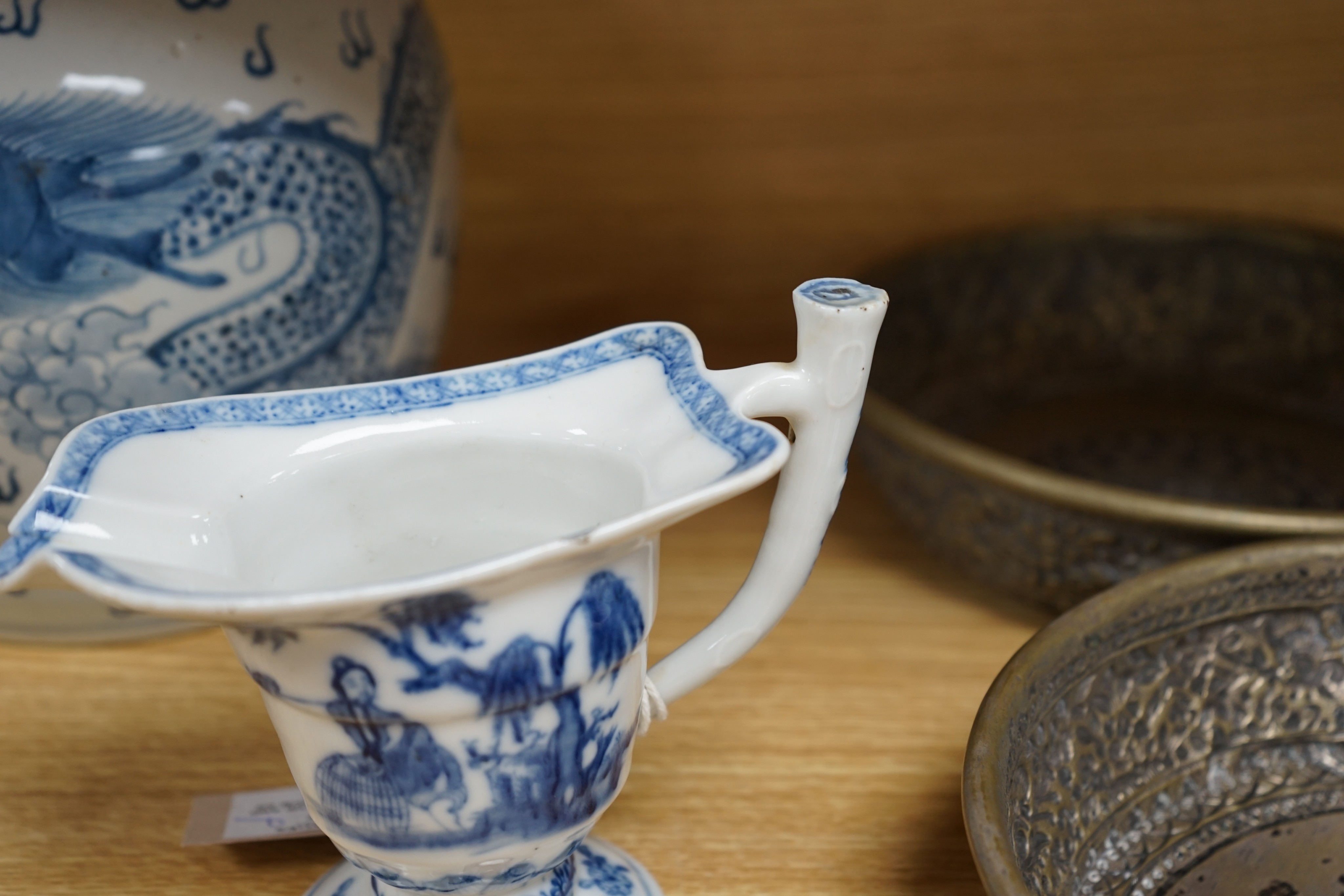 A Chinese blue and white jar, 20cm and a helmet shaped jug, 18th century and later